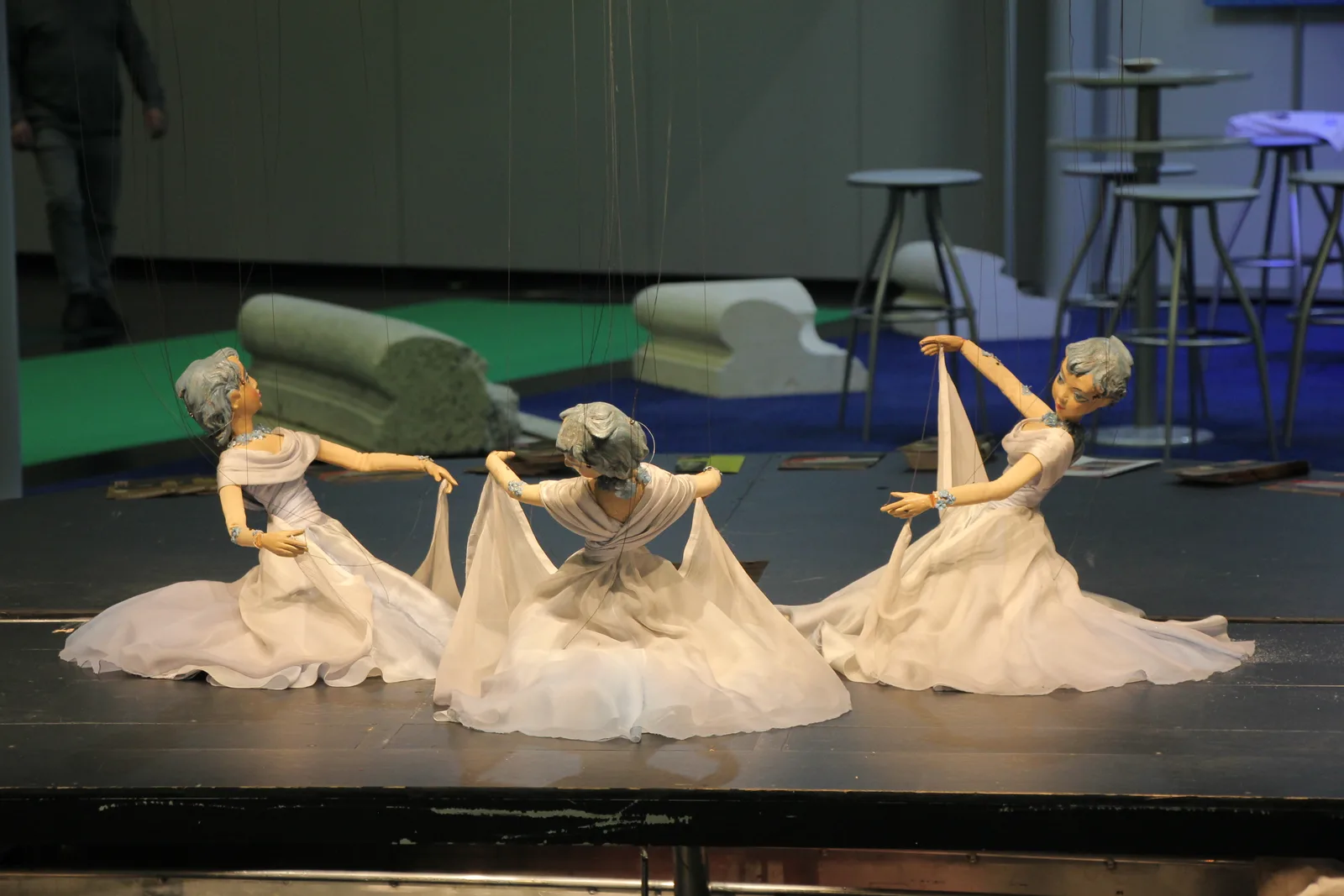 Costumed marionettes mid-scene on the stage of the Salzburg Marionette Theatre